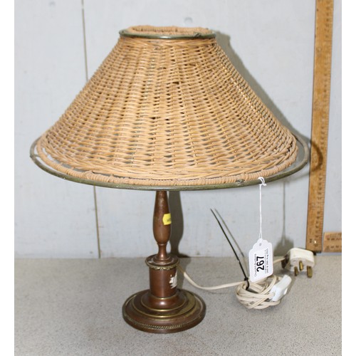 267 - An unusual vintage brass lamp with a woven wickerwork shade, approx 42cm tall