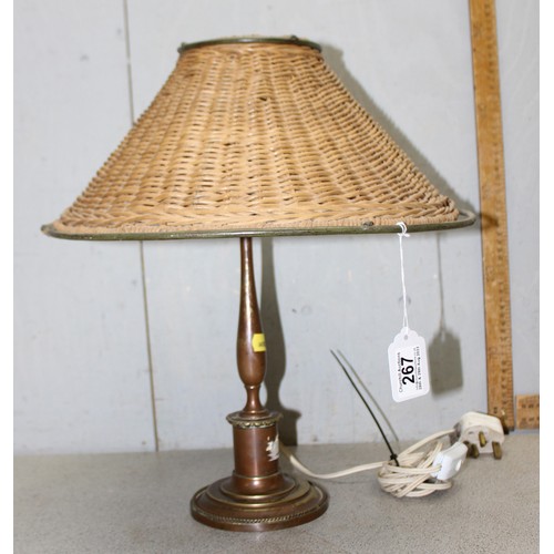 267 - An unusual vintage brass lamp with a woven wickerwork shade, approx 42cm tall