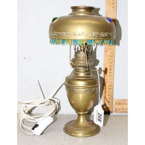 269 - A vintage brass lamp with brass shade with beadwork edging, approx 30cm tall