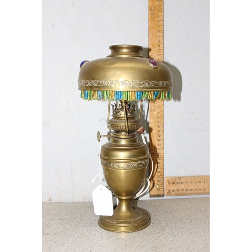 269 - A vintage brass lamp with brass shade with beadwork edging, approx 30cm tall