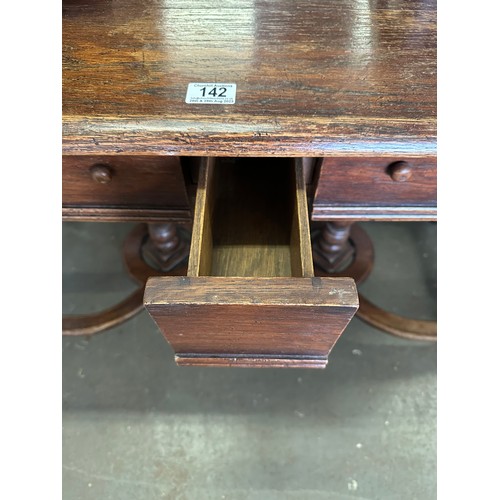 142 - A 17th century style oak side table with 2 main drawers and smaller middle hidden drawer. An unusual... 