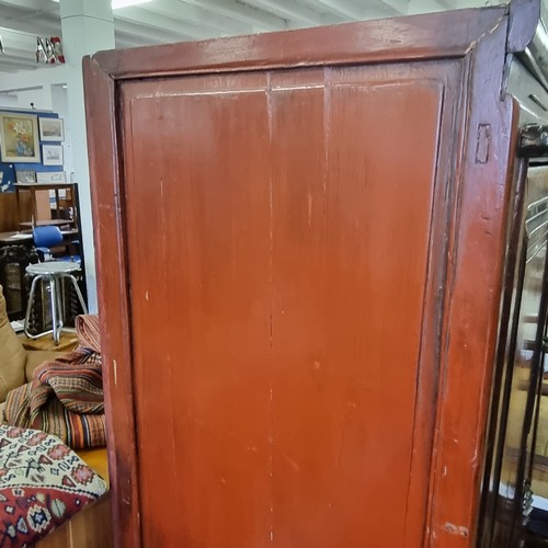 167 - A Chinese hardwood cabinet, the doors opening to reveal 3 shelves and a single drawer, likely early ... 