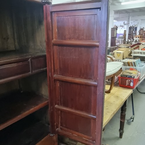 167 - A Chinese hardwood cabinet, the doors opening to reveal 3 shelves and a single drawer, likely early ... 