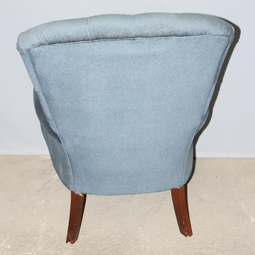 31 - A Victorian style blue button back armchair with turned legs