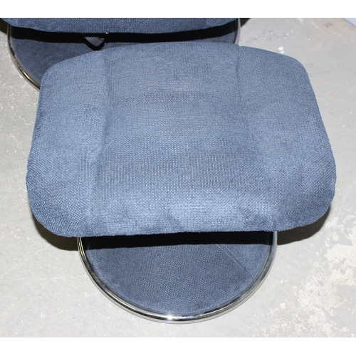 34 - A retro style blue fabric Lazyboy type armchair with footstool