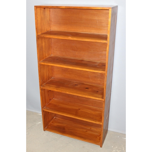 10 - Stained pine bookcase, approx 76cm wide x 29cm deep x 152cm tall