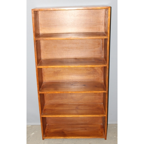 10 - Stained pine bookcase, approx 76cm wide x 29cm deep x 152cm tall