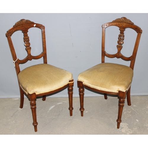 32 - A pair of antique bedroom chairs with stuffed seat and carved backs