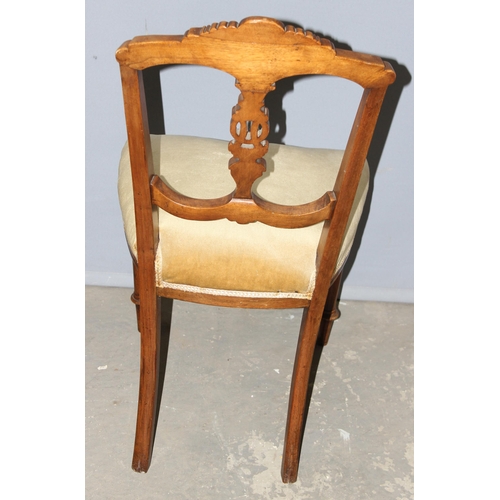 32 - A pair of antique bedroom chairs with stuffed seat and carved backs