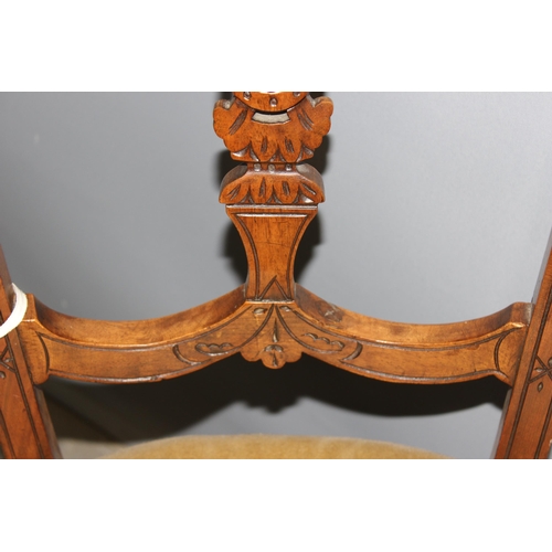 32 - A pair of antique bedroom chairs with stuffed seat and carved backs