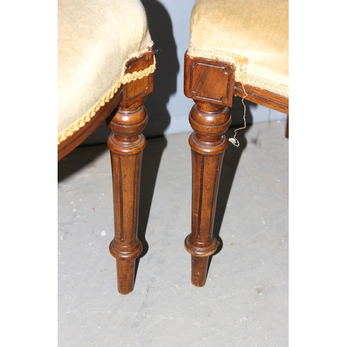 32 - A pair of antique bedroom chairs with stuffed seat and carved backs