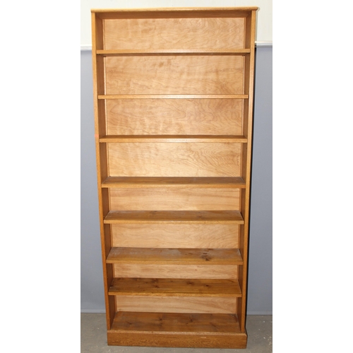 5 - A good quality modern light oak bookcase with adjustable shelves, approx 95cm wide x 25cm deep x 213... 