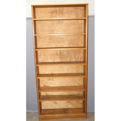 3 - A good quality modern light oak bookcase with adjustable shelves, approx 95cm wide x 25cm deep x 213... 