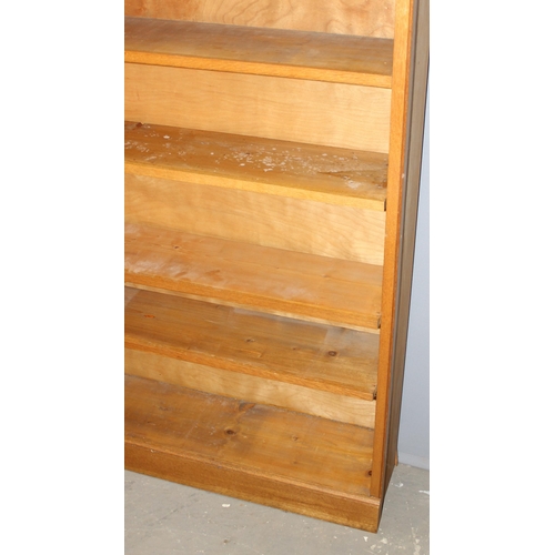 3 - A good quality modern light oak bookcase with adjustable shelves, approx 95cm wide x 25cm deep x 213... 