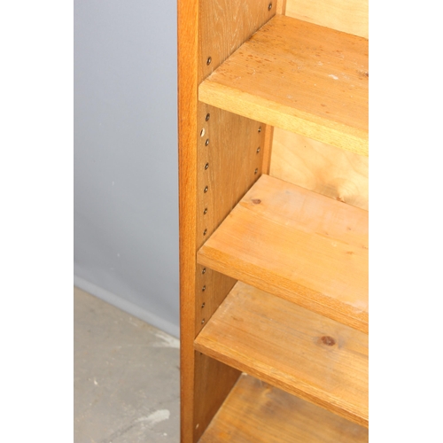 3 - A good quality modern light oak bookcase with adjustable shelves, approx 95cm wide x 25cm deep x 213... 