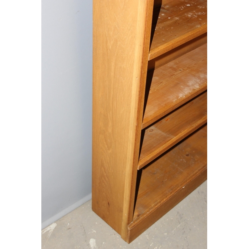 3 - A good quality modern light oak bookcase with adjustable shelves, approx 95cm wide x 25cm deep x 213... 