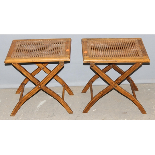 23 - A pair of early 20th century folding topped bergère campaign stools, approx 38cm wide x 30cm deep x ... 