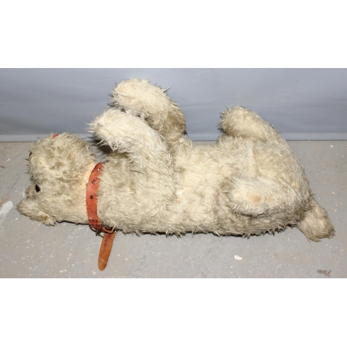 1507 - An early 20th century straw stuffed toy dog with a Tail Waggers Club collar tag, approx 73cm long