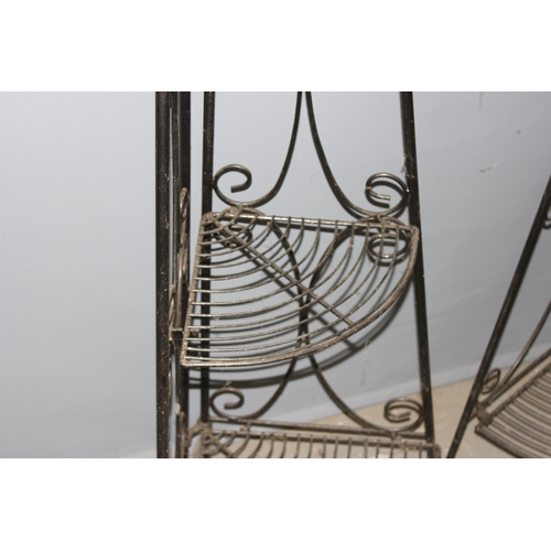 345 - A pair of antique style folding wrought iron garden plant stand shelves, each approx 32cm wide x 24c... 