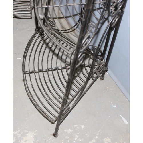 345 - A pair of antique style folding wrought iron garden plant stand shelves, each approx 32cm wide x 24c... 