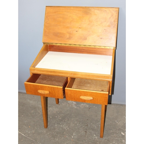 141 - Jack Berry of Wallingford, a bespoke made mid 20th century light oak desk with 2 drawers, in the sty... 