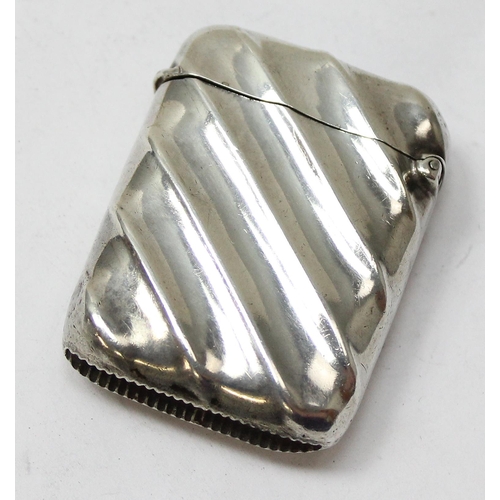 1018 - An antique silver vesta case of ribbed form, Birmingham 1896 by Minshull & Latimer, approx 23.37g gr... 