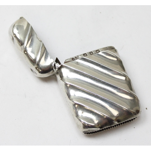 1018 - An antique silver vesta case of ribbed form, Birmingham 1896 by Minshull & Latimer, approx 23.37g gr... 