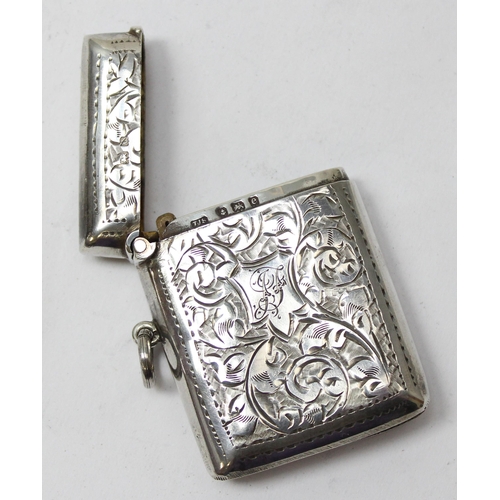 1019 - An antique silver vesta case with acanthus scroll engraving, Birmingham 1904 by Thomas James Skelton... 