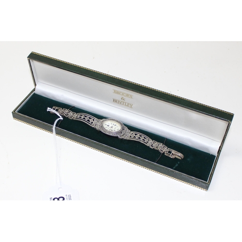 1318 - An Art Deco style silver marcasite cocktail watch by Brooks & Bentley, boxed