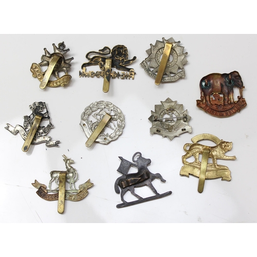 1413 - 10 assorted military cap badges to include, British Asian Yeomanry, Notts & Derby, West Riding, Bedf... 