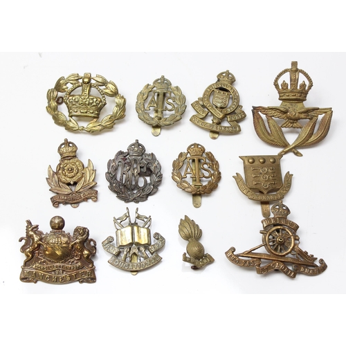 1419 - 11 assorted military cap badges and others to include, Intelligence Corps, RAOC, ATS, Manchester Reg... 