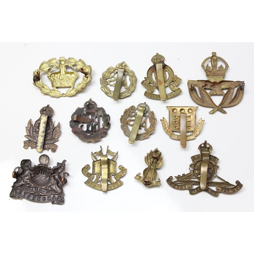 1419 - 11 assorted military cap badges and others to include, Intelligence Corps, RAOC, ATS, Manchester Reg... 