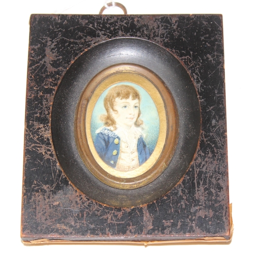 406 - A small antique portrait miniature of a young boy in Regency period dress, seemingly unsigned, in an... 