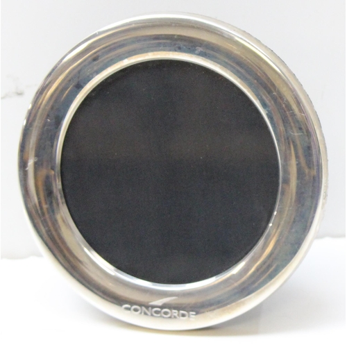 1030 - A round silver Concorde photograph frame, marked for Sheffield 1997 by Carr's, approx 12cm in diamet... 