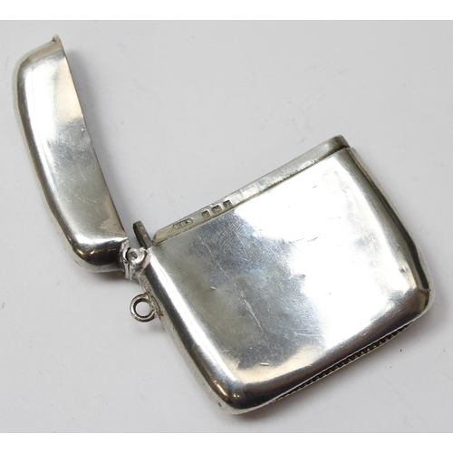 1025C - An antique plain silver vesta case of slightly curved form, Birmingham 1910 by William Henry Sparrow... 