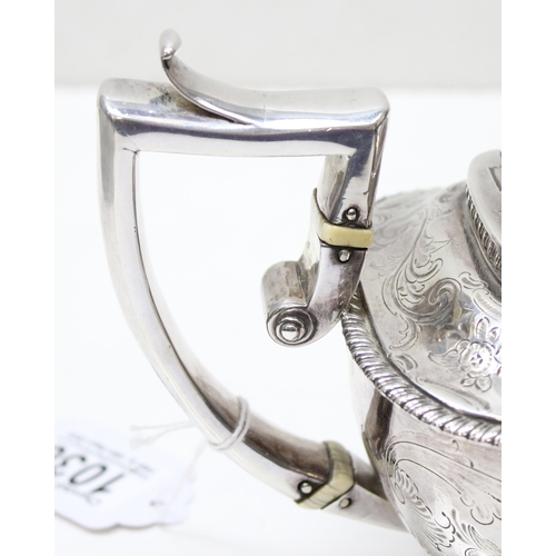 1001 - A George III period silver tea pot with engraved and embossed floral decoration, London 1814 by Char... 