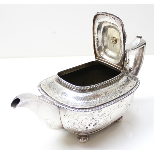 1001 - A George III period silver tea pot with engraved and embossed floral decoration, London 1814 by Char... 