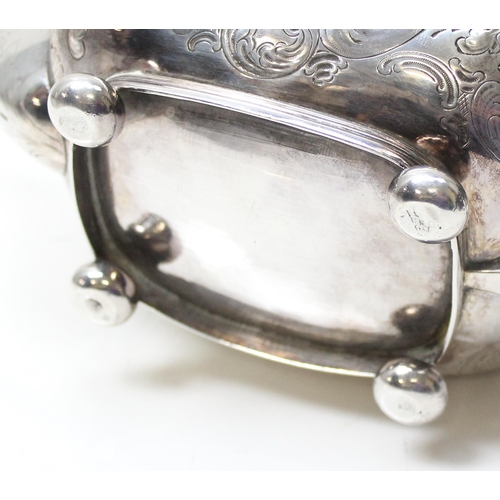 1001 - A George III period silver tea pot with engraved and embossed floral decoration, London 1814 by Char... 