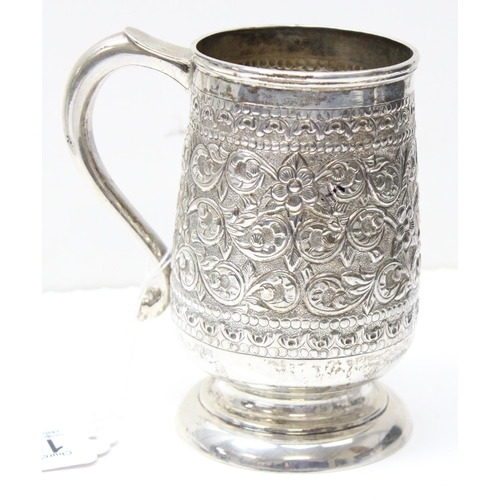 1033 - A large 19th century embossed silver pint tankard, likely Anglo-Indian, marked Sterling Silver to th... 