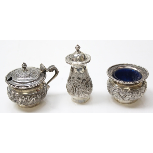 1036 - An Indian embossed silver 3 piece cruet set with blue liners and tray, all pieces marked Silver and ... 