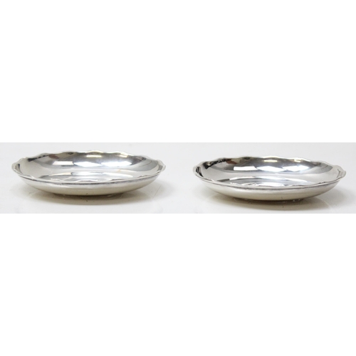 1041 - A pair of Hong Kong silver pin dishes by Wai Kee, with inset Hong Kong junk dollar coins, each appro... 