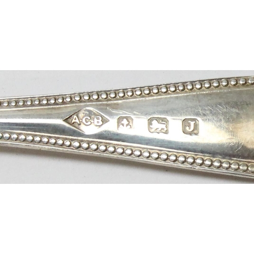 1059 - A boxed set of 6 silver teaspoons with sugar tongs, Birmingham 1933 by AC Bloxham, approx 93.69g gro... 