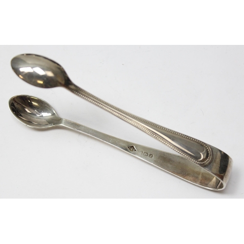 1059 - A boxed set of 6 silver teaspoons with sugar tongs, Birmingham 1933 by AC Bloxham, approx 93.69g gro... 