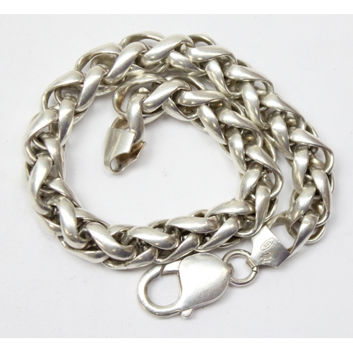 1102 - An Italian 925 silver heavy gauge bracelet of twisted interlocking links, approx 21cm long, approx 4... 