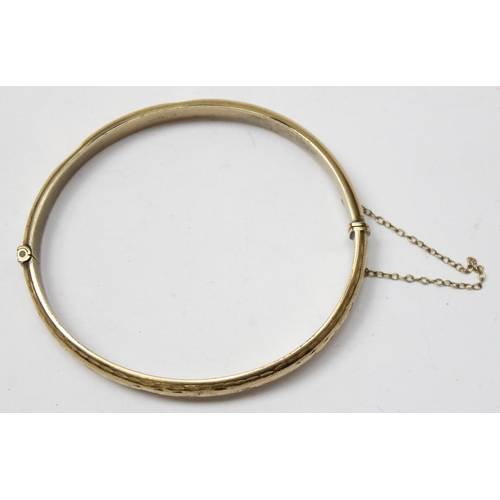 1104 - 9ct gold cuff bangle with engraved decoration, Birmingham 1964, approx 8.41g gross