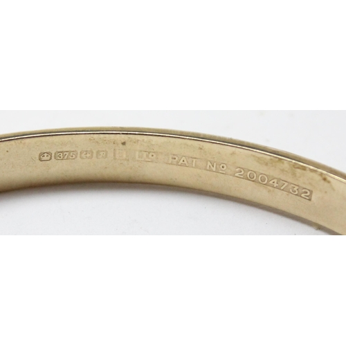 1104 - 9ct gold cuff bangle with engraved decoration, Birmingham 1964, approx 8.41g gross