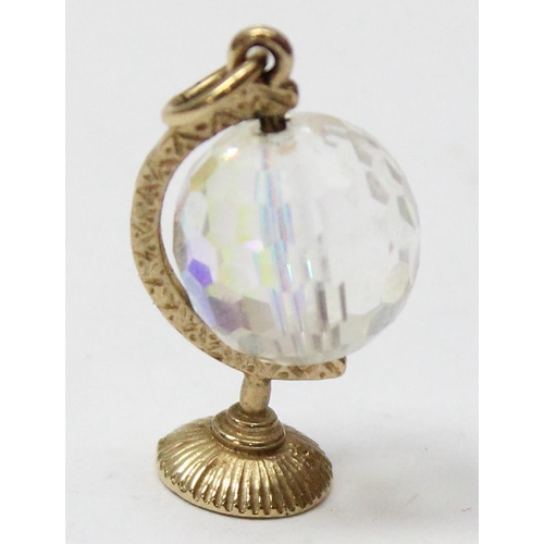 1106 - A 9ct gold mounted charm formed as a facet cut crystal globe, approx 3.83g gross