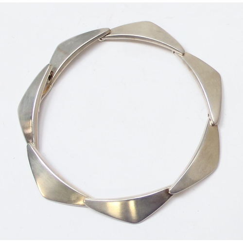 1112 - Georg Jensen of Denmark, a retro style silver bracelet made up of stylised triangular links, marked ... 