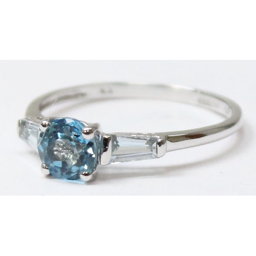 1116 - 9ct white gold ring set with a central blue stone, likely a Topaz and flanked by 2 baguette cut whit... 