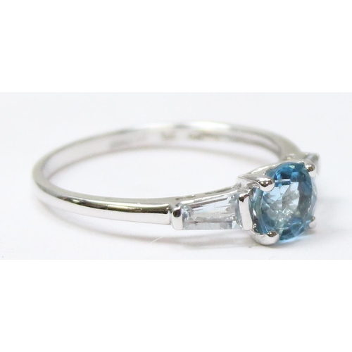 1116 - 9ct white gold ring set with a central blue stone, likely a Topaz and flanked by 2 baguette cut whit... 